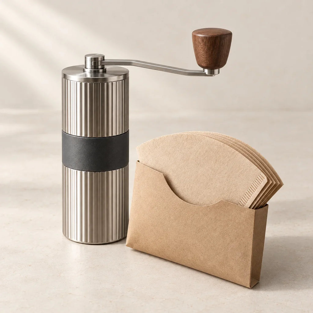 Manual coffee grinder with a paper filter pack