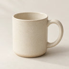 Ivory ceramic mug with a speckled glaze