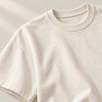 Crewneck and shoulder stitching of the ivory T-shirt